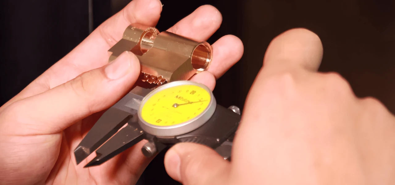 inspector measuring the dimensions of a lock cylinder