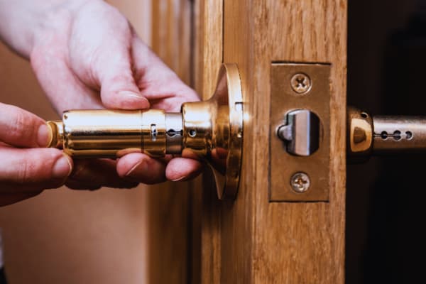 Pulling the core out as part of how to remove a door lock cylinder