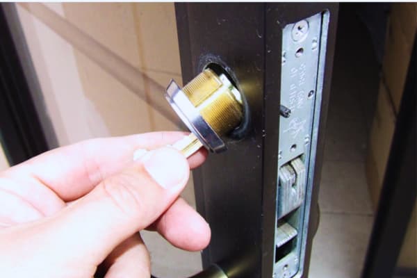 Removing storefront components for how to change a lock cylinder