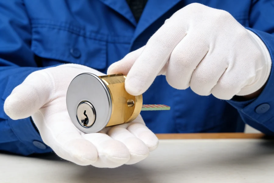 Professional locksmith replacing Rim Cylinder lock for better protection